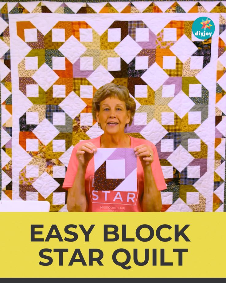 an older woman holding up a star quilt with the words easy block star quilt on it