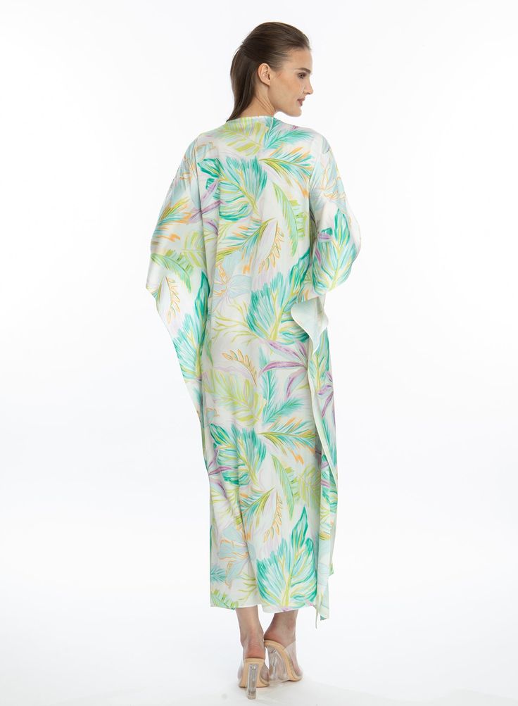 Unwind in style with our Bahamas GREEN Long Caftan. This piece is designed to be both soft and breathable, allowing for comfort and freedom of movement. Plus, it's machine washable for easy care! Printed long caftan Elegant, loose, dreamy fit Lusciously soft poly-silk blend for ease of care Machine wash cool Tumble-dry low Green Flowy V-neck Kimono, Green Cover-up For Summer Loungewear, Green Summer Cover-up For Loungewear, Green V-neck Kimono For Vacation, Green Summer Loungewear Cover-up, Green Flowy Kaftan With Short Sleeves, Green Flowy Short Sleeve Kaftan, Green Short Sleeve Kaftan For Vacation, Green Long Printed Kaftan