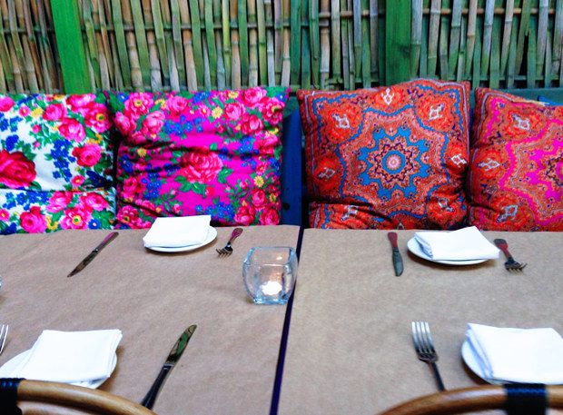 the table is set with place settings for two people to sit down and enjoy their meal