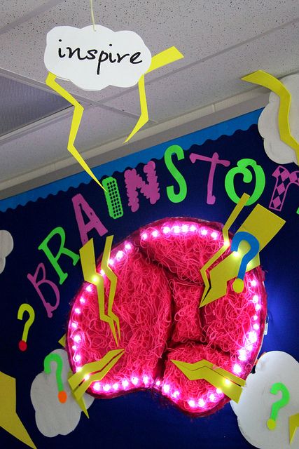 a neon sign that says bran stor and has been decorated with bright colored lights