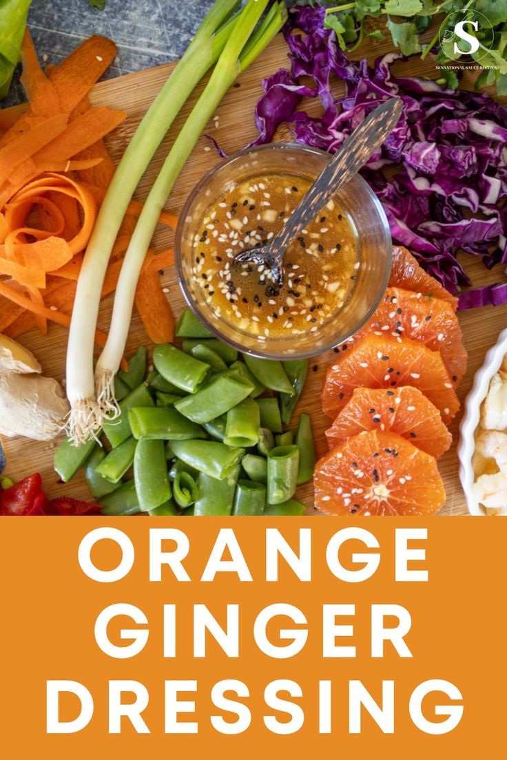 orange ginger dressing on a cutting board surrounded by vegetables