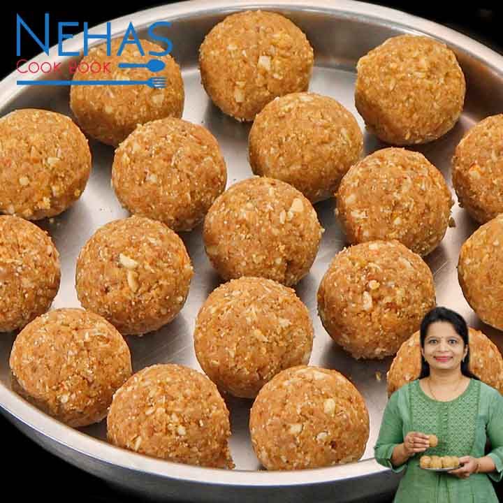 a woman standing in front of a metal pan filled with food balls on top of a table