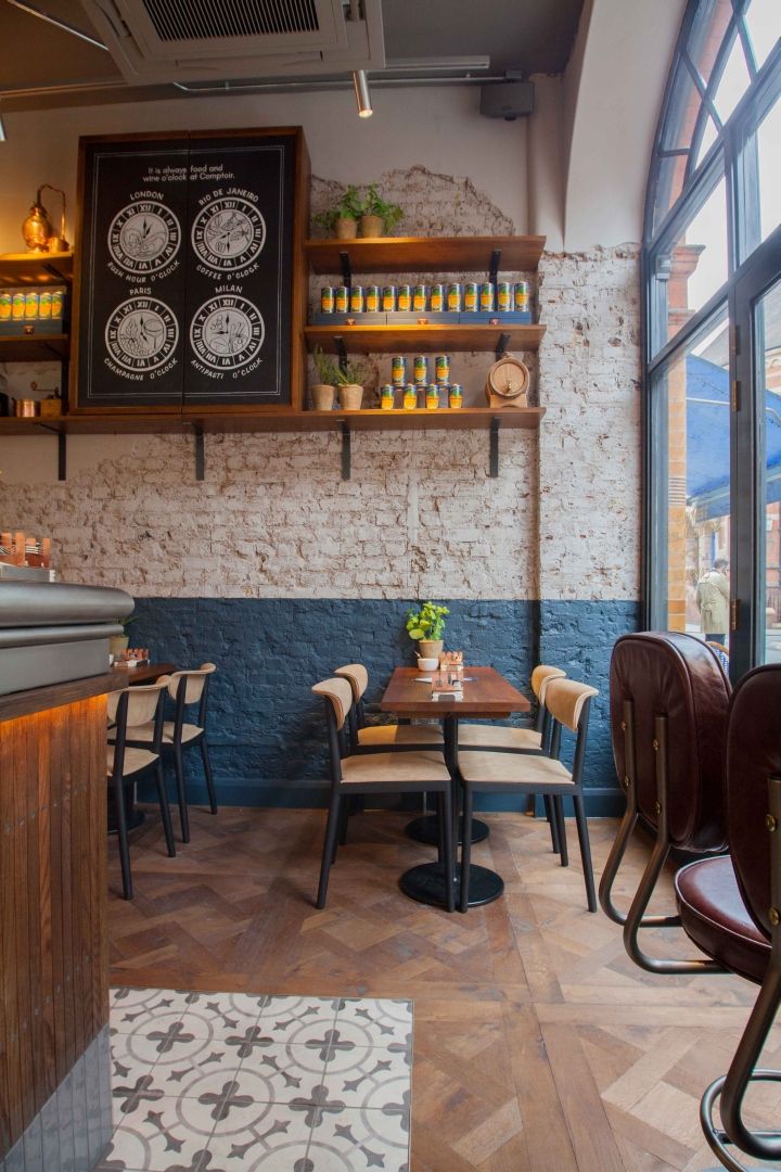 the inside of a restaurant with tables and chairs