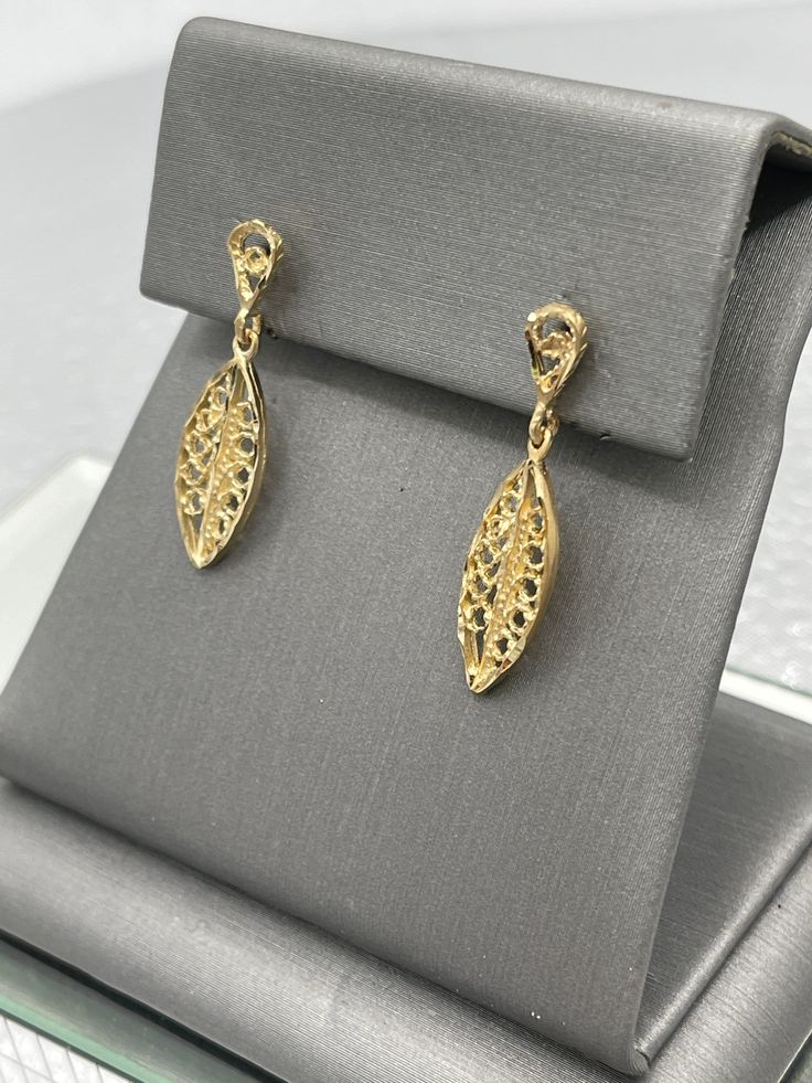 "This classic pair of earrings were designed and made in 14 karat solid yellow gold. Such a beautiful and feminine pair of earrings with exceptional filagree craftsmanship and design!   Wear them for every day and enjoy the comfortable teardrop studs. Weight-2.0 grams Dimensions-1\" x ¼\" Our Price $145.00 Regularly Priced At $280.00 Please See Our Video Remember - whether you're purchasing for yourself or a gift for a loved one, Buy With Confidence!  We Guarantee Everything We Sell!  SKU # E670" 2 Grams Gold Earrings Designs, Gold Teardrop Earrings, Gold Earrings Designs, Dangling Earrings, Gold Drop Earrings, Solid Yellow, Teardrop Earrings, Designer Earrings, Earings Piercings