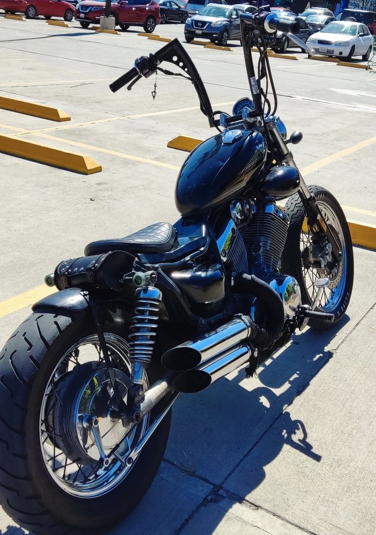 a blue motorcycle parked in a parking lot