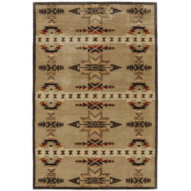 an area rug with native style design on the front and back of it, including arrows