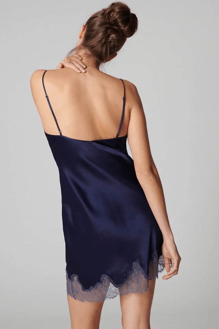 Classic and elegant, discover the Nocturne slip by Simone Pérèle. Crafted from beautiful blue silk, this luxury slip dress features a v-neckline with tulle detail and refined lace on the hem. Thin adjustable shoulder straps allow for your desired fit. A must-have piece for daytime elegance and night-time seductiveness.• Designed in France by Simone Pérèle.• Nightdress in midnight blue.• Soft, luxurious silk.• V neckline.• Tulle detail at the neckline.• Elegant, refined lace.• Adjustable shoulder Silk Nightdress, Simone Perele, Blue Soft, Blue Silk, Beautiful Blue, V Shape, Pure Silk, Midnight Blue, Night Dress