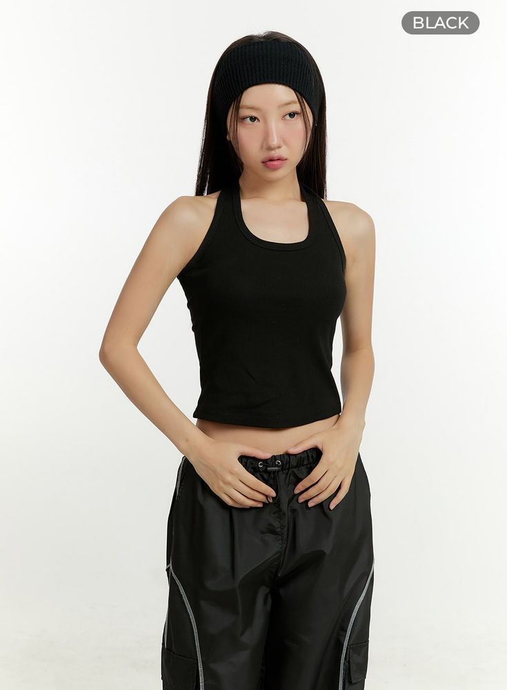 Product Detail Style : Street, Athleisure Detail : Cut out, Strap Print : Solid Material : Cotton Sleeve : Tank top Neck : Halter neck Length : Crop Cotton100 Color : Black, Light beige Model Size Model is wearing size S/M and the color Black. Height : 5'5" | 166cm / Top : S / Bottom : S (25 inch) .prddescription table, .prddescription td, .prddescription th { border : 1px solid black; border-collapse : collapse; padding: 10px; } Size(Inch) Size Shoulder Bust Armhole Hem Total Length S/M 6.3" 24 Casual Sports Crop Top, Sporty Solid Tops For Streetwear, Solid Color Sporty Streetwear Tops, Sporty Solid Color Streetwear Tops, Casual Black Tank Crop Top, Casual Moisture-wicking Crop Top For Sports, Basic Racerback Top For Streetwear, Black Tank Top Athleisure Style, Black Casual Crop Top For Workout