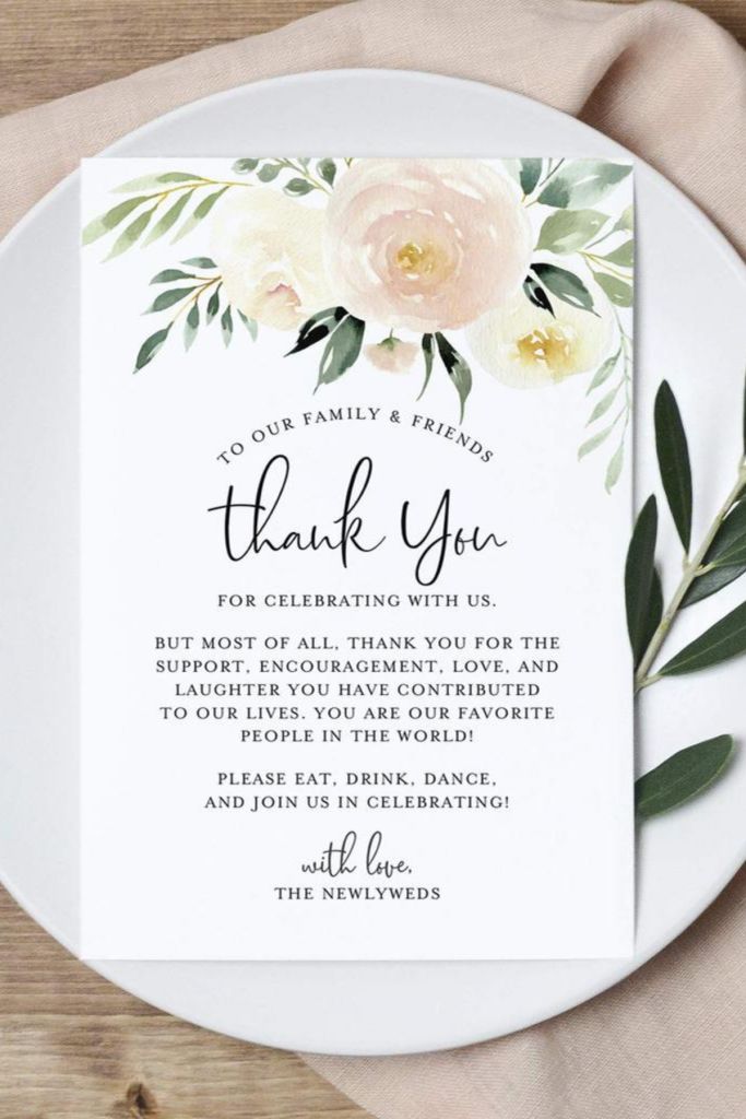 a white plate with flowers and greenery on it, the words thank you are written in