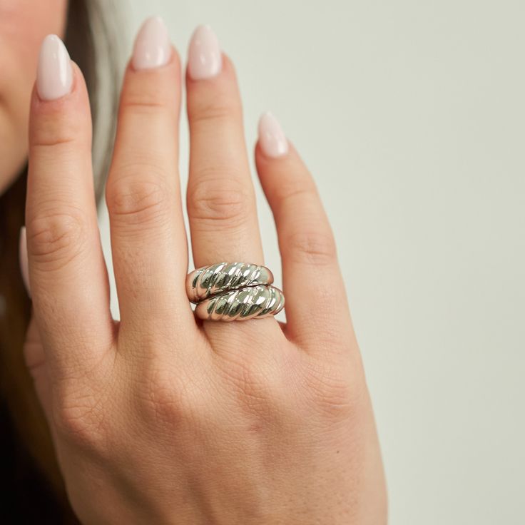 PRODUCT DETAILS Waterproof💧💧💧 Stainless Steel White Rhodium Hypoallergenic Nickel Free DESIGNER NOTE Discover the exquisite craftsmanship of our Braided Ring, a silver masterpiece that weaves together elegance and artistry. This ring's intricate braided design creates a striking visual texture that embodies both strength and grace, making it a symbol of timeless beauty and individuality. Style Tip: Elevate your Bohemian-inspired look by wearing the Braided Ring alongside layered bracelets and Elegant Metal Wide Band Ring For Anniversary, Timeless Tarnish-resistant Silver Engraved Ring, Timeless Tarnish-resistant Engraved Silver Ring, Sterling Silver Tarnish Resistant Rings For Anniversary, Silver Dome Ring Tarnish Resistant, Silver Engraved Ring Tarnish Resistant Round Band, Silver Engraved Ring With Tarnish Resistant Round Band, Elegant Silver Midi Rings Tarnish Resistant, Silver Engraved Ring Tarnish Resistant