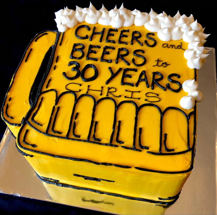 a cake that has been decorated to look like a beer mug with the words cheers and 30 years on it