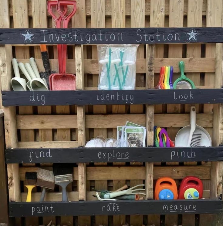 a wooden crate filled with lots of different types of utensils