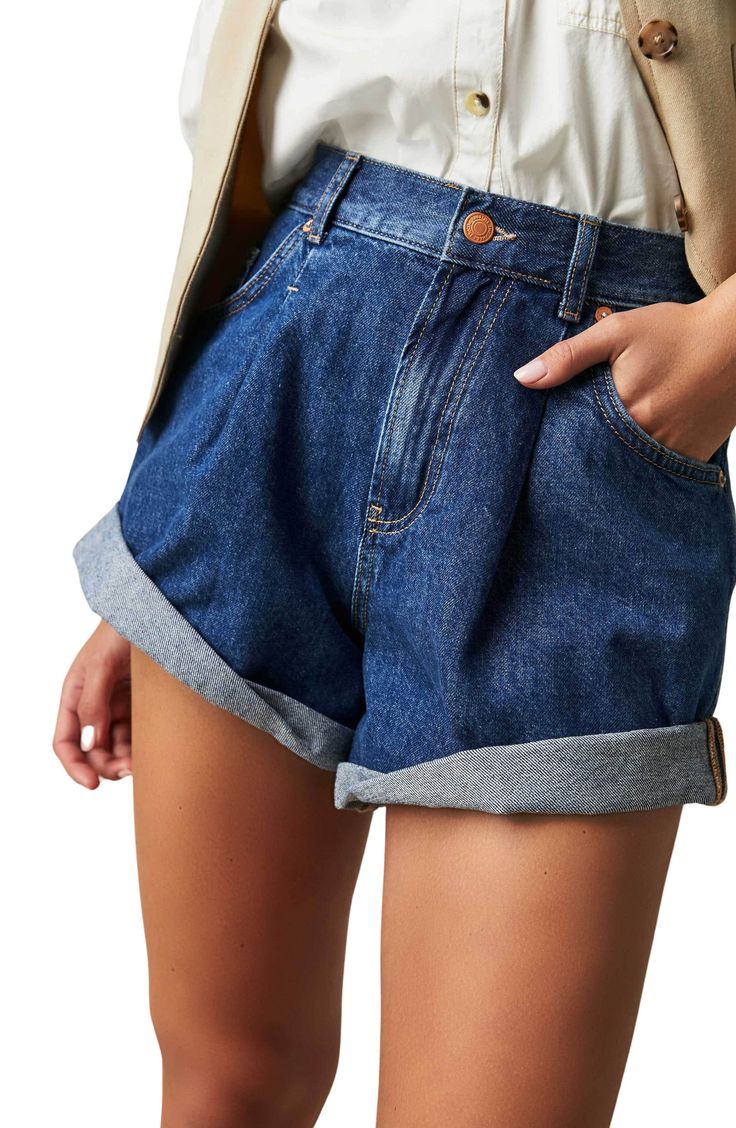 These roll-cuff shorts made from nonstretch denim are cut in a slouchy silhouette and meant to look slightly oversized. 3 1/2" inseam; 29" leg opening; 13 1/2" front rise; 15 1/2" back rise (size medium) Zip fly with button closure Five-pocket style 100% cotton Machine wash, tumble dry Imported Cuffed Denim Shorts, Simple Tees, Cuffed Shorts, High Rise Shorts, Sheer Blouse, Dressed Down, Pocket Design, Denim Fashion, Boho Outfits