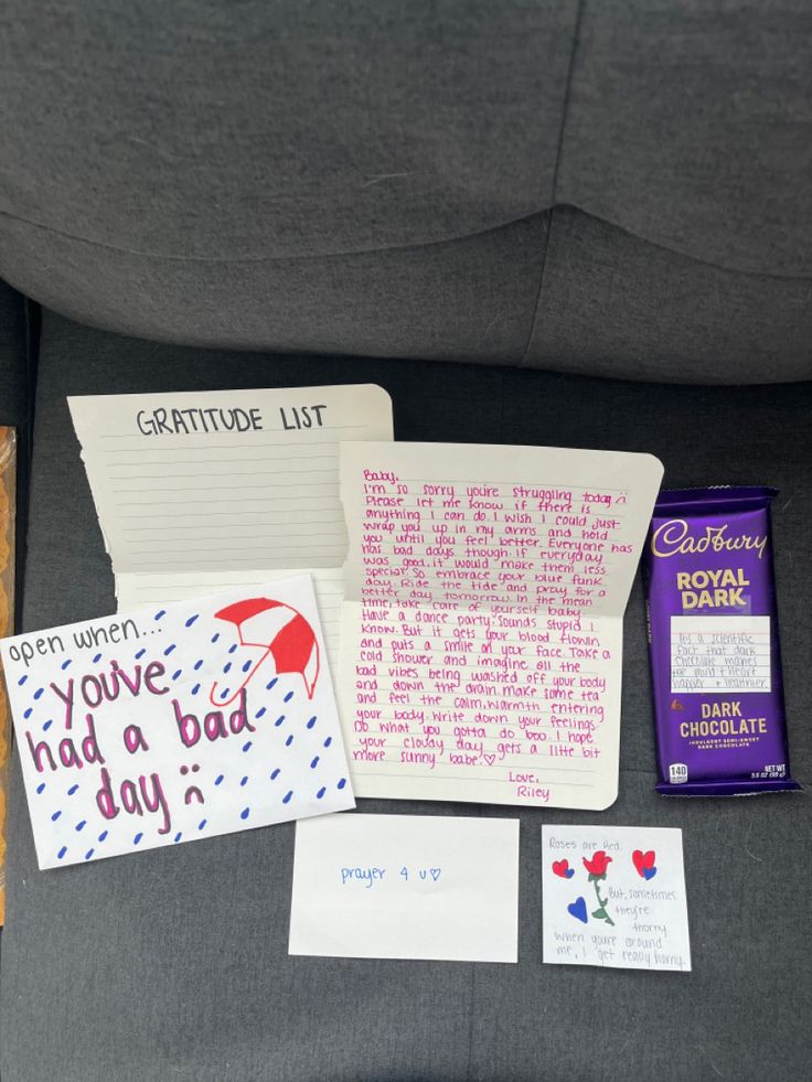 the back seat of a car with notes, candy and other items on it