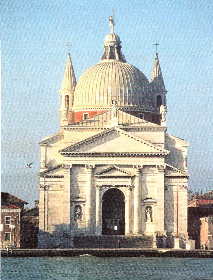 an old church in the middle of a body of water