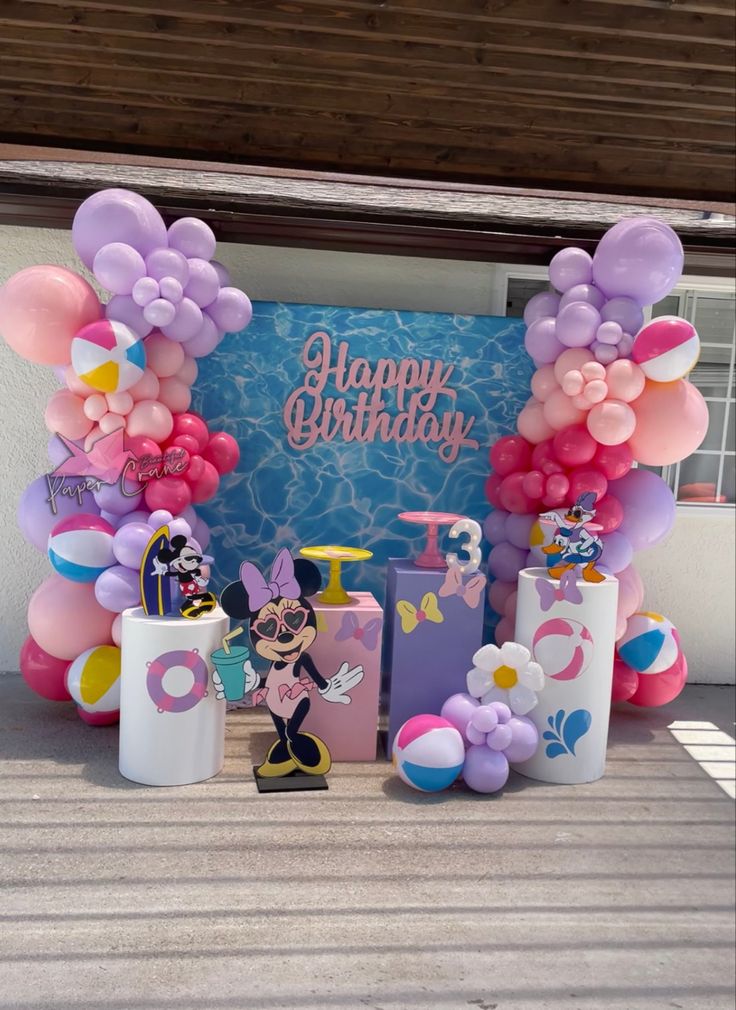 a birthday party with balloons and decorations