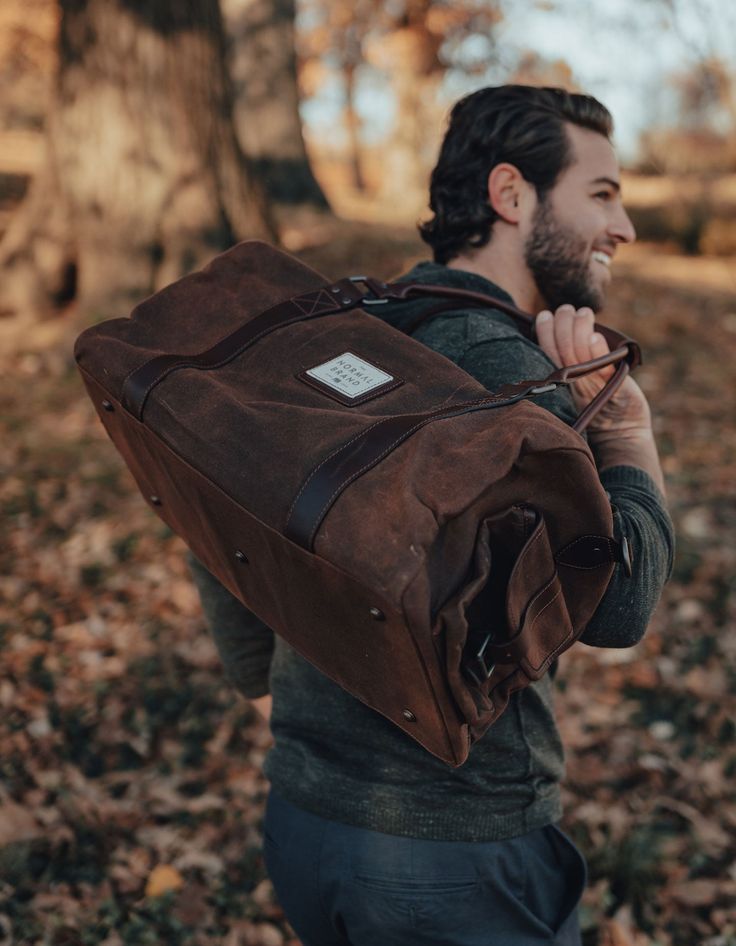 Our waxed canvas bag, with leather finishes, is designed to carry everything you need for the weekend. Inspired by our buddy and photographer, Garrett King, we wanted to design a bag that you could take anywhere and not have to worry about it standing up to the test. Garrett travels around the world and battles mother nature to get the perfect photos. Our bag will hold everything you need for a quick trip to the gym or deep into the wilderness. Waxed Canvas Bag, Bison Leather, Carry On Size, Henley Sweater, Perfect Photos, Weekend Bag, The Wilderness, Waxed Canvas, Fall Shopping