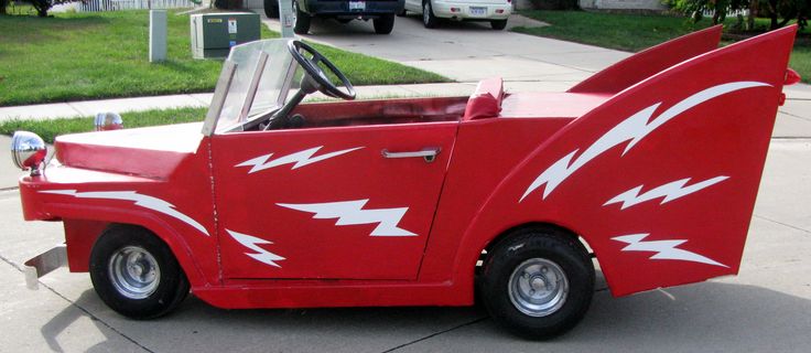 a red car with white lightning bolt designs on it's hood and side door