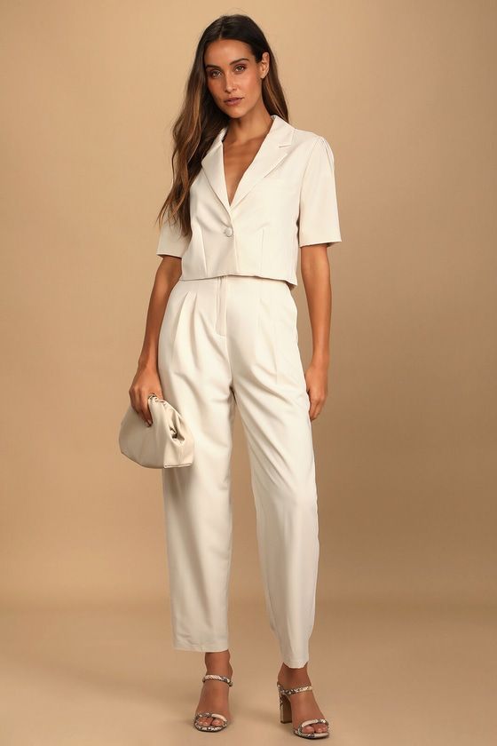 The Lulus Posh Company Ivory Pleated High-Waisted Trouser Pants will take your confidence levels to new heights! These dress pants are composed of woven fabric that shapes a pleated high-rise silhouette (with elastic at the back for fit), belt loops, a fabric-covered top button, and a hidden zip-fly. Relaxed, straight pant legs with side seam pockets end at ankle-length hems. Pair with the matching blazer for a complete look! Fit: This garment fits true to size. Length: Ankle length. Size medium Cropped Blazer Dress, Company Dinner Outfit, Short Sleeve Blazer Outfit, Short Blazer Outfits, Crop Blazer Outfit, Cropped Blazer Outfit, High Waisted Trouser Pants, Summer Business Casual Outfits, Short Jackets