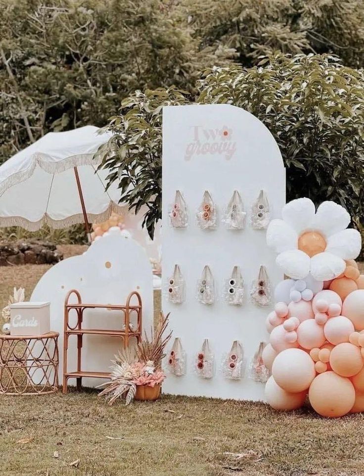 an outdoor display with balloons and shoes on it