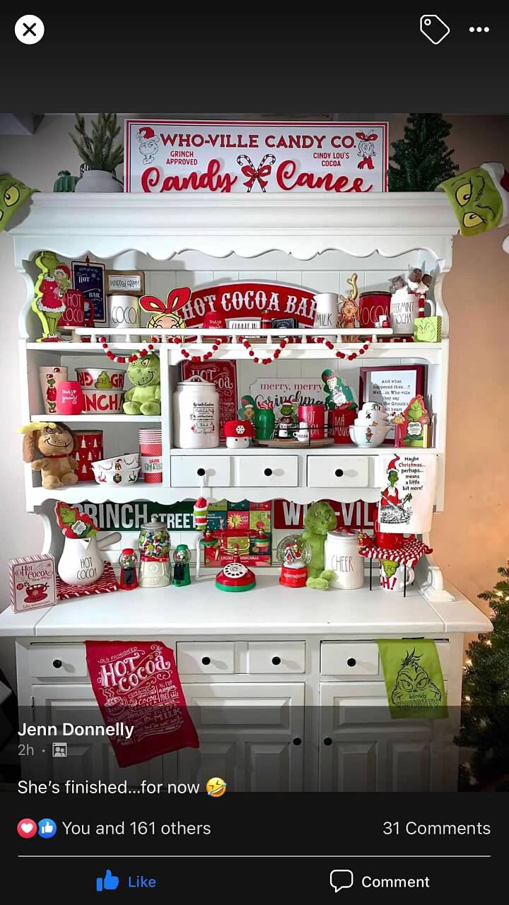 an old fashioned christmas display with candy and candies on the shelves, decorated in red and green