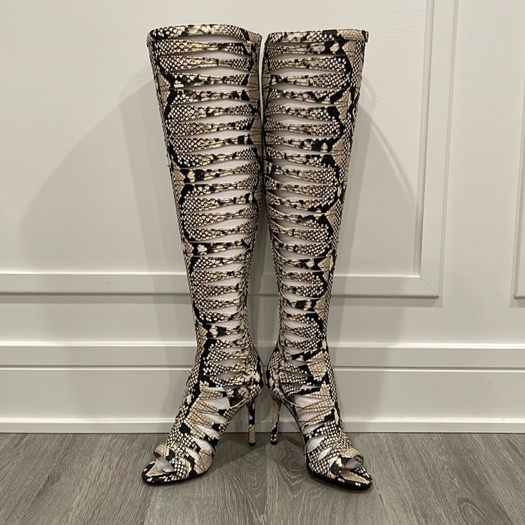 Vince Camuto Over The Knee Gladiator Peep Toe In Snakeskin Size 5.5. Okaaayy!!!! I Have Serious Size Envy Right Now! These Are Hot And So Glad They Are Back In! Low Comfortable Heel. Back Zip Ends Below/At The Knee For Zero Irritation. Plus It Just Looks So Much Better Then A Full Zip! These Are The Perfect Gladiator! Please Notethese Absolutely Can Come With The Box And Original Packaging But It’s Over Posh’s Size Limit Which Will Incur Extra Shipping Costs Which Will Be Added After Purchase. S Fitted Open Toe Boots With 4-inch Heel, Fitted Beige Lace-up Boots, Fitted Lace-up Heels With Leather Sole, Lace-up Boots With 4-inch Heel And Fitted Design, Beige Boots With Padded Heel, Fitted Beige Boots With Padded Heel, Fitted Lace-up Boots With 4-inch Heel, Fitted Snip Toe Heels For Fall, Beige Fitted Snip Toe Boots