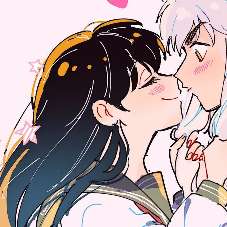 two anime characters kissing each other with hearts in the background