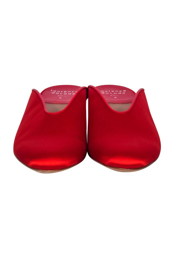 Take the holidays to new heights with these Laurence Dacade red satin mules! Featuring a rounded toe silhouette and statement block heel, these elegant heels will add a splash of festive color to any ensemble. Be a showstopper in these sassy holiday stunners! Size 10 (IT 40) Made in Italy Satin upper Lather sole and lining Slip on Round toe Block heel Comes with box and dust bag Heel height 2.5" Red Evening Sandals With Deep Heel Cup, Party High Heel Mules With Red Sole, Red High Heel Mules For Formal Occasions, Red Pointed Toe Block Heels For Evening, Red Pointed Toe Mules For Evening, Elegant Red Mules With Sculpted Heel, Formal Red Mules With Padded Heel, Evening Red Mules With Red Sole, Red Mules With Red Sole For Evening