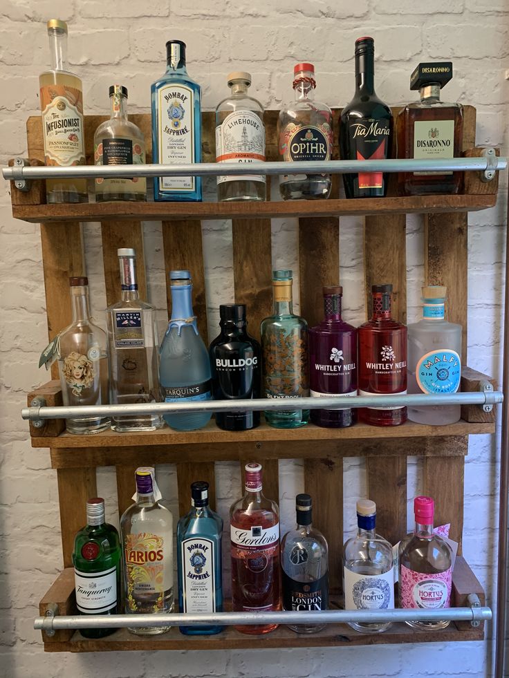 a shelf filled with lots of liquor bottles