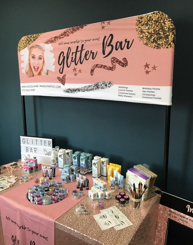 a table with glitter bar on it and various items for sale at the counter top