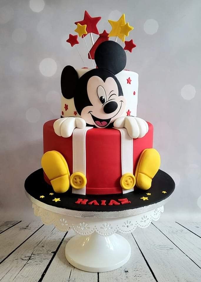 a mickey mouse cake with stars on top