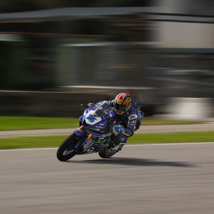 a person riding a motorcycle on a race track