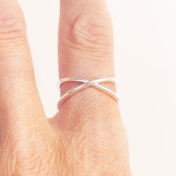 Ring Criss Cross Minimalist in Sterling Silver by Jungle Via View chart in the images to determine your size  Sizes: This ring is adjustable as the ring is not fused together (view images) it is bent to a size 7 but if you like I can adjust it for you. Minimalist Adjustable Open Band Ring, Adjustable Simple Stackable Rings, Minimalist Adjustable Simple Rings, Adjustable Minimalist Midi Rings With Simple Design, Minimalist Adjustable Midi Rings, Simple Adjustable Sterling Silver Ring, Adjustable Open Ring Minimalist Style, Adjustable Silver Midi Rings Minimalist Style, Adjustable Open Midi Rings As Promise Rings