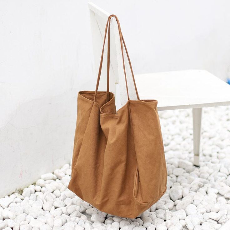 Detail: Item Type: Handbag Material: Canvas Closure Type: None Style: Casual, Daily Size: Length: 40.00 cm/ 15.75 " Width: 22.00 cm/ 8.66 " Height: 35.00 cm/ 13.78 " Minimalist Beige Shopping Bag, Minimalist Beige Shoulder Bag For Shopping, Simple Solid Color Canvas Shoulder Bag, Simple Everyday Canvas Shoulder Bag, Simple Solid Canvas Shoulder Bag, Everyday Solid Color Canvas Bag, Minimalist Beige Bags For Everyday Use, Minimalist Beige Tote Hobo Bag, Minimalist Beige Hobo Tote Bag