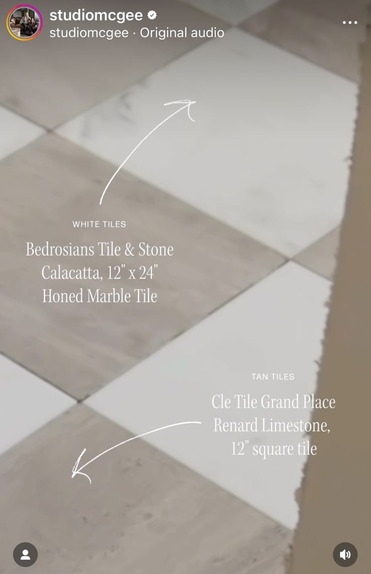 the tile floor is white and gray with some black arrows pointing up to it's right