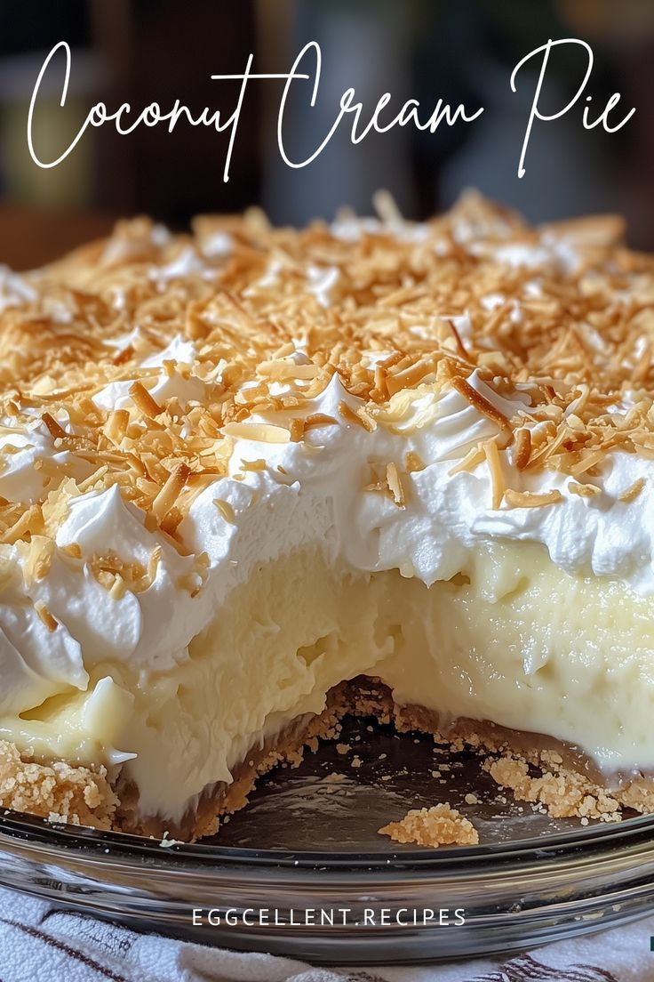 a close up of a pie on a plate with coconut creme and whipped cream