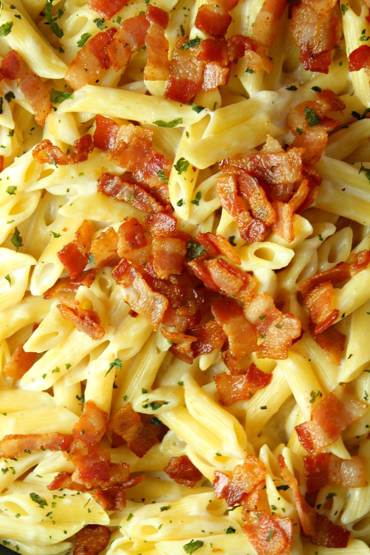 pasta with bacon and parmesan cheese in a pan