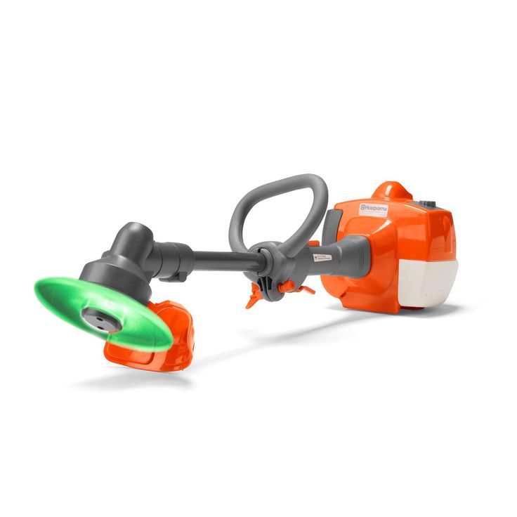 an orange and white toy with a green light