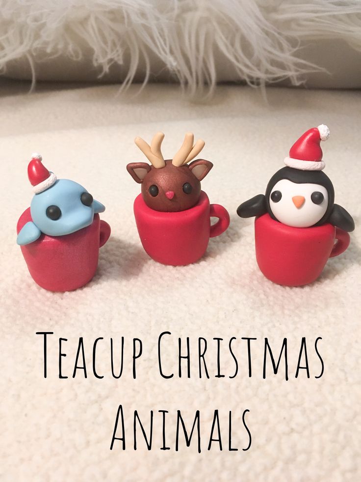 three cupcakes with christmas decorations on them and the words teacup christmas animals