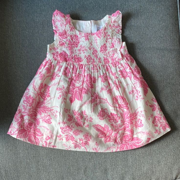 100% Cotton Bin A Pink Ruffled Sundress For Dress-up, Pink Cotton Dress With Ruffles, Playful Pink Cotton Floral Dress, Playful Pink Floral Cotton Dress, Pink Short Sleeve Cotton Dress, Playful Pink Floral Print Dresses, Playful Pink Floral Dress With Ruffles, Fitted Pink Cotton Dress, Playful Pink Fitted Sundress