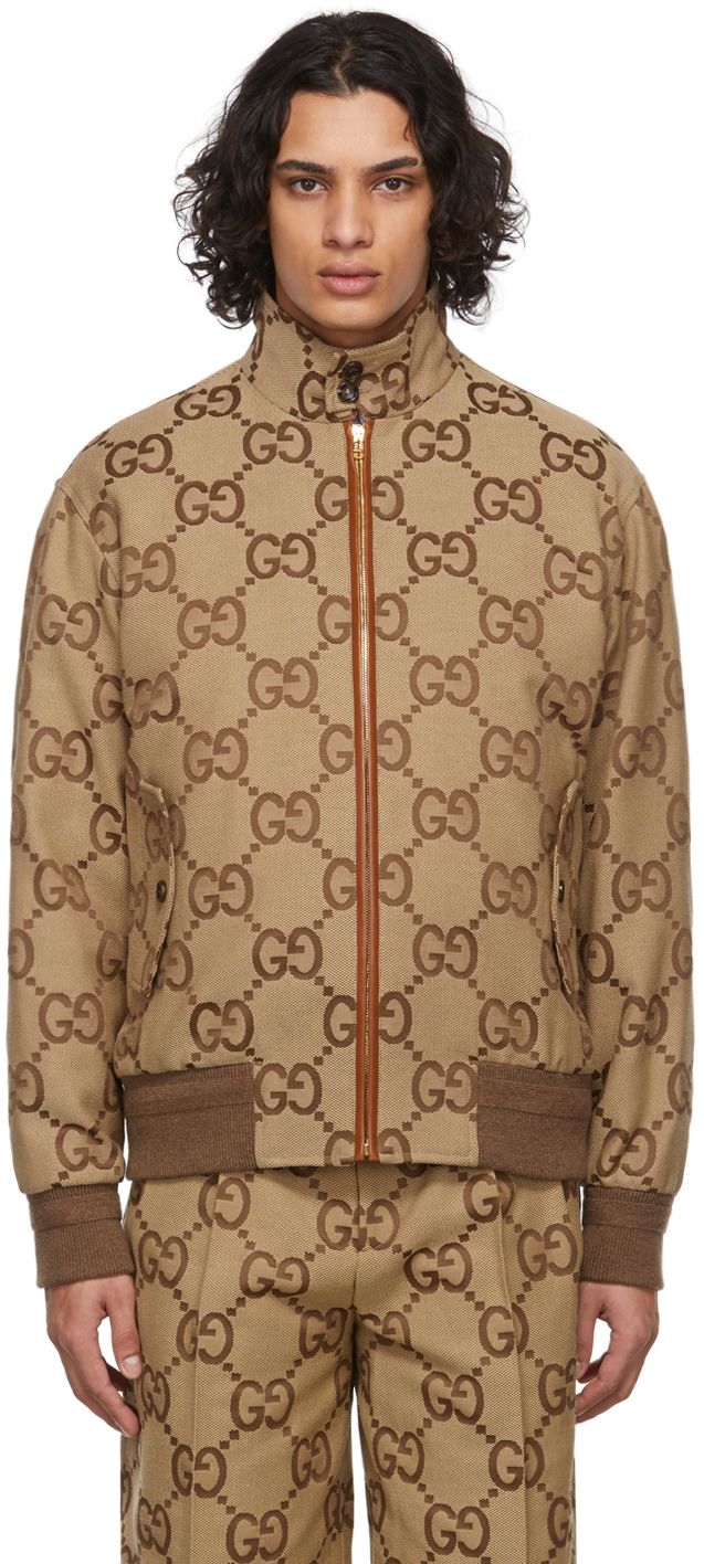 Find Gucci Beige Canvas Jumbo Gg Jacket on Editorialist. Long sleeve cotton canvas jacket in beige featuring logo pattern in brown. · Stand collar · Lambskin trim in tan at zip closure · Flap pockets at waist · Rib knit cuffs and hem · Full twill lining · Gold-tone hardware Supplier color: Camel/Ebony Gucci Jacket Mens, Gucci For Men, Gucci Jacket, Gucci Outfits, Canvas Jacket, Buy Gucci, Logo Pattern, Gucci Men, 1 800