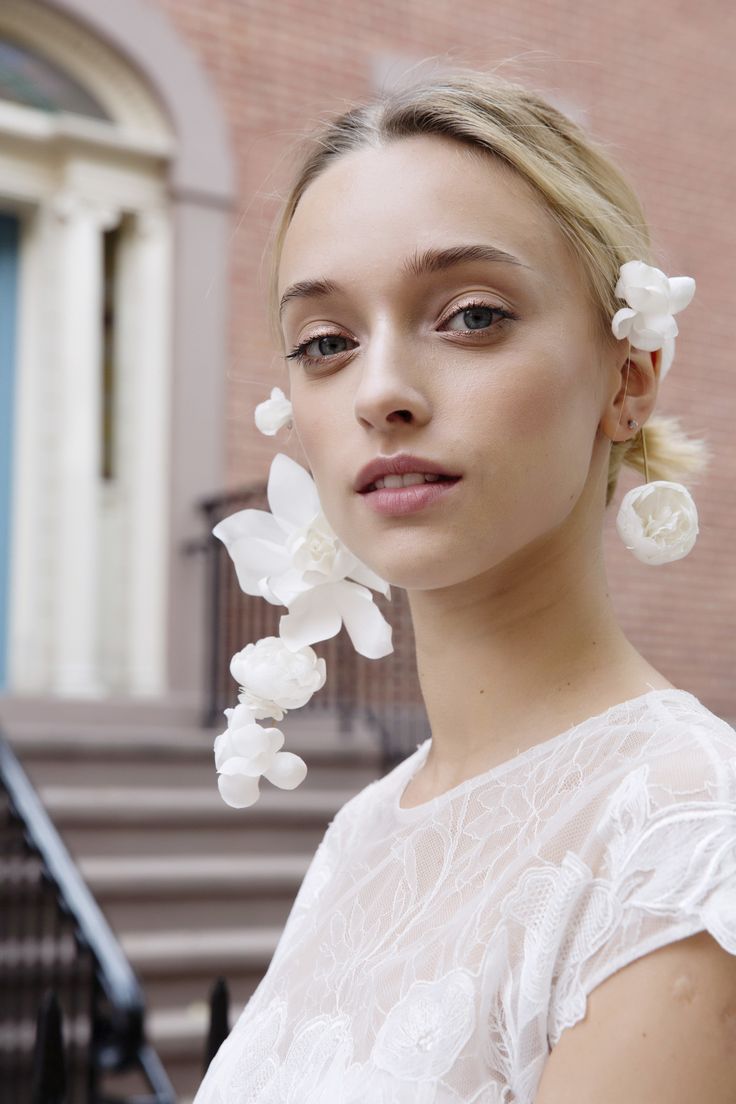 a woman with white flowers in her hair