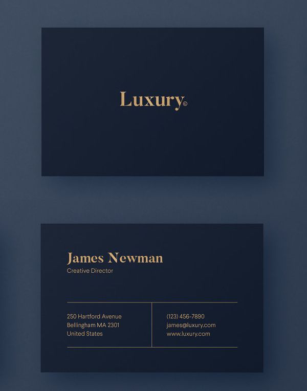 two business cards with gold foil on them, one is black and the other is dark blue