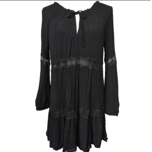 Length Above The Knee Flowy Bohemian Style Dress With Lace Detailing Black Flowy Bohemian Dress, Black Bohemian Dress With Loose Fit, Black Flowy Boho Dress, Flowy Black Boho Dress, Black Peasant Dress For Summer, Black Flowy Boho Dress For Festival, Black Peasant Dresses, Black Long Sleeve Bohemian Dress, Black Long Sleeve Dress For Festival