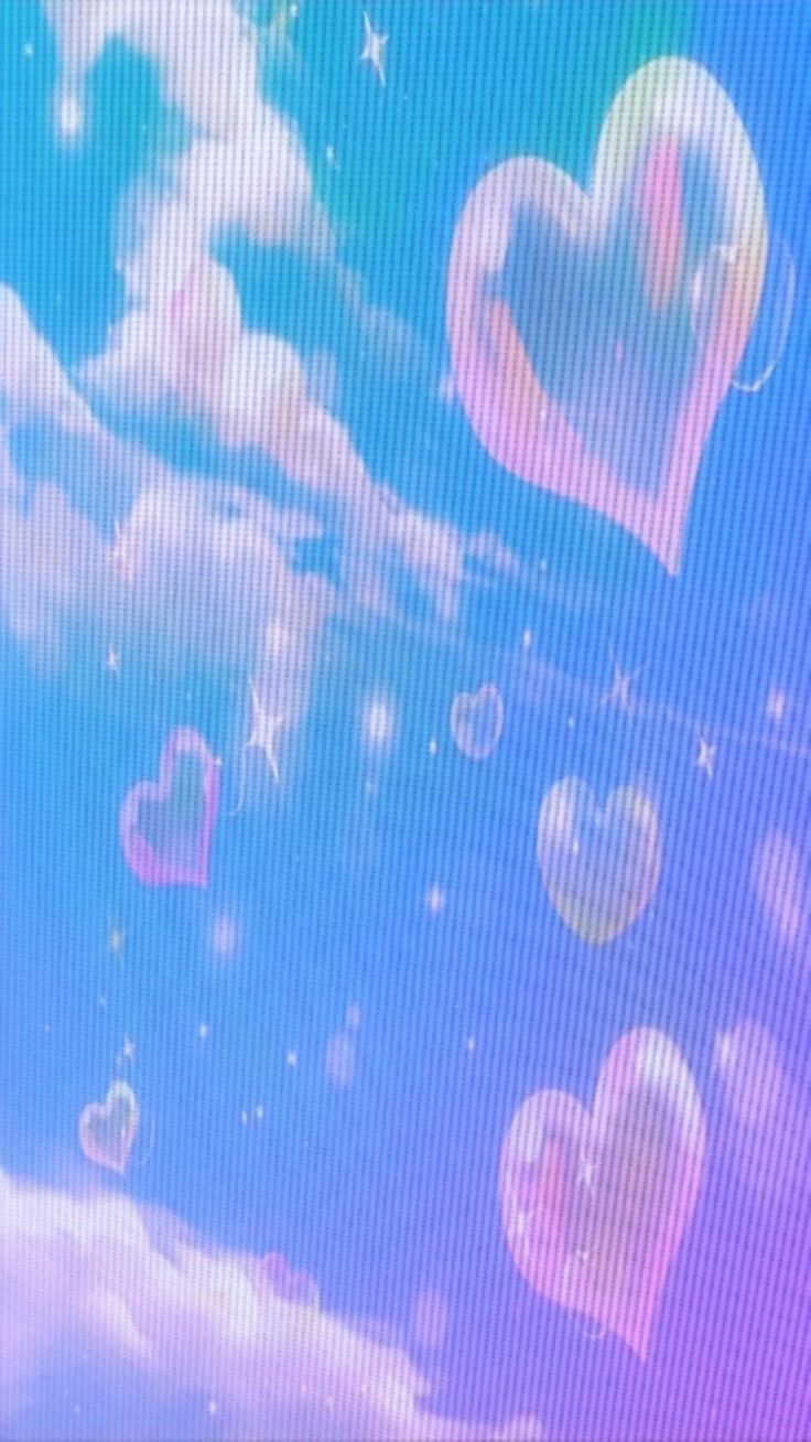 there are many heart shaped bubbles floating in the air and on the screen as if they were flying through the air