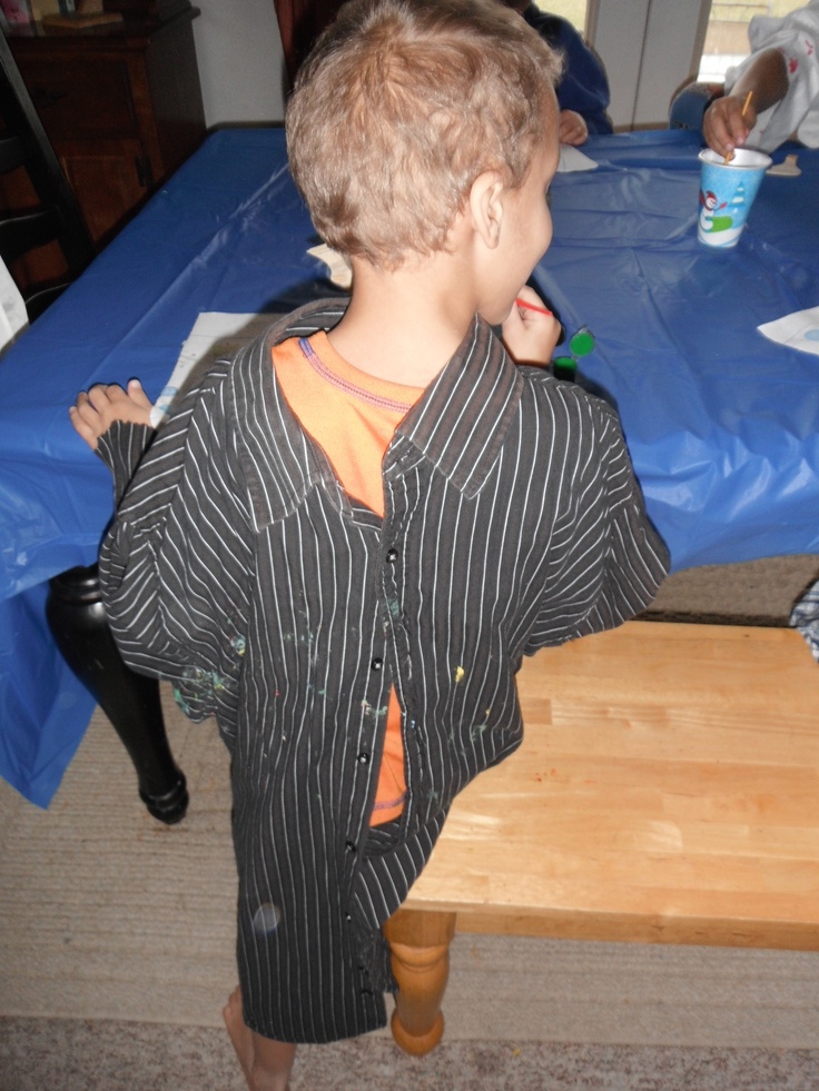 a little boy that is standing up on a table