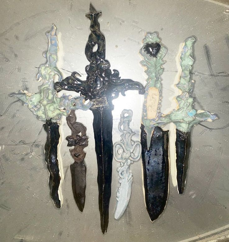 four different types of knifes hanging on a wall