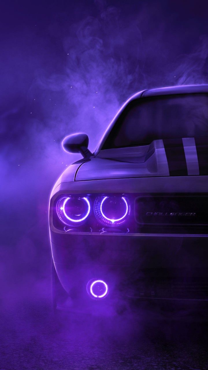 the front end of a car with purple lights