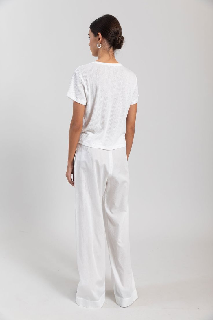 Please note this item is available for pre-order only at this time. Estimated shipping: Late May. Breeze into summer. Our bestselling Yoko Pocket Pant returns: Cut in 100%, crisp cotton lawn, this wear-anywhere pant features a comfortable elasticized waistband, side seam pockets, the perfect relaxed fit. Effortless White Loungewear Bottoms, White Relaxed Sweatpants With Loose Fit, White Wide-leg Sweatpants With Side Pockets, White Relaxed Wide Leg Pants With Elastic Waistband, White Wide Leg Sweatpants With Side Pockets, White Versatile Pants With Elastic Waistband, Versatile Lounge Pants With Elastic Side Panels, Versatile White Pants With Elastic Waistband, Casual Bottoms With Straight Hem For Daywear