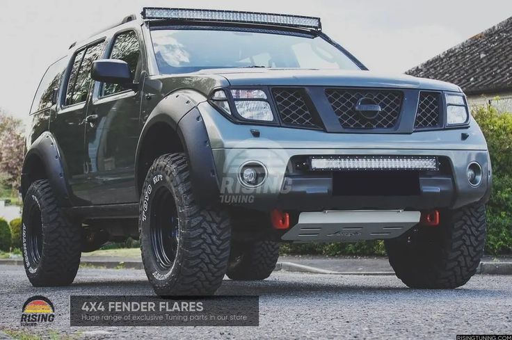 the front end of a grey four door pick up truck